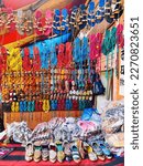 Small photo of A riot of colors and styles on display in the vibrant street sandals market. Browse the intricate designs and haggle with vendors to find the perfect pair.