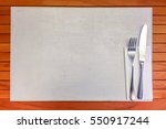 Silver Fork and knife with White Napkin Top View on wooden table background