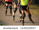 Group of rollerblader (skater) in the evening sun