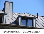 Small photo of Dormer with zinc cladding on a tiled roof