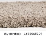 Light grey shaggy floor carpet fluffy with texture. one type of thick carpet with gunny sack backing structure