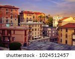 City landscape at sunset of the day in the Italian city of La Spezia. Traditional architecture of Italy. Brick residential buildings of citizens.