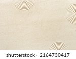 Small photo of Circle lines on sand, beautiful sandy texture. Natural sand background for spa wellness, concept for relaxation balance and harmony spirituality. Concentration and spirituality in Japanese zen garden