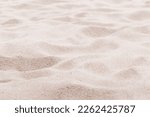 Beige pink Sand texture natural background. Close up waves pattern on sand dunes, light pastel color, minimal nature backdrop, beautiful beach. Summer and travel, spa and relaxation concept. 