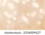 Defocused abstract bokeh background beige pastel colored, flare from lights, beige monochrome photo, blurred round bokeh as holiday fon, celebration wallpaper. Glittering aesthetic textured pattern