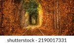 Small photo of Autumn tunnel of love. The railway runs through a dense forest. A great place for romantic walks and photo sessions. The city of Kevan, Ukraine.