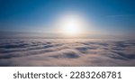 Small photo of Be inspired by the beauty and majesty of a dawn sky with this awe-inspiring image of a sunrise over clouds. The breathtaking colors and serene atmosphere will fill you with hope and joy