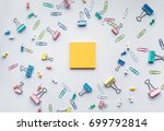 Notepad with set of colorful paper clips on white background.business creativity concepts.Flat lay design