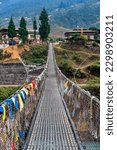 Small photo of The Punakha Suspension Bridge at the Punakha Dzong is an important part of the architectural history of Bhutan. The longest suspension bridge in Bhutan and always decorated with colorful prayer flags.