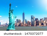 The Statue of Liberty with the One world Trade building center over hudson river and New York cityscape background, Landmarks of lower manhattan New York city. Architecture and building concept