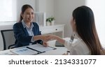 Small photo of Asia startup SME woman people happy smile talking in wealth service plan advice deal, home loan will at lawyer desk sale office. HR job consult sign in legal paper. Bank trust in Trader tax agent.