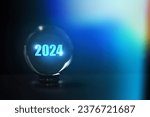 Small photo of New year 2024 displayed glass ball , year planing, shiny 2024 glitter light glass ball ,2024 life prediction, good and happiness magic year, Life manifesting background