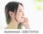 Japanese woman with a beautiful smile and hands on her face, easy to use for beauty Copy space