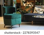 Green velvet armchair in contemporary bistro