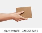 Mockup, Hands delivering a carton box, delivery service