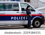Small photo of Vienna, Austria, 06-10-2023, Austrian police in the center of Vienna, Policeman, Policewoman, Police car
