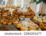 table with snacks, catering for a wedding, white color