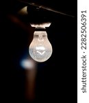 Small photo of An incandescent light bulb, incandescent lamp or incandescent light globe is an electric light with a wire filament heated until it glows. The filament is enclosed in a glass bulb with a vacuum.