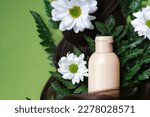 Small photo of sustainable and cruelty-free products nourish and revitalize your hair and scalp, leaving you with healthy, radiant locks. Nature's beauty of hair adorned with ferns and daisies.