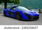 Small photo of Como, Italy - October 28, 2023: Perfect day to take a ride around Lake Como in your bright blue McLaren P1.