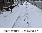 An image of footsteps in snow