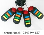 Small photo of GEELONG VICTORIA AUSTRALIA 11TH APRIL 2020 - Set of 4 wired Buzz controllers with red lights and colored control buttons made for PS2 Sony Playstation 2 console buzz quiz trivia and other video games