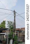 Small photo of Ngawi, august 17 2028, There are a mixture of 3 poles, the tallest and largest is the electrical installation pole, the 2 smaller and lower poles are iron poles belonging to the internet provider.