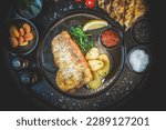 Top View of Grilled Boneless Turbot Fillet: Delicate White Fish, Steamed Spinach, Roasted New Potatoes, Healthy Gourmet Meal, Tasty Culinary Experience, Balanced Flavors, Appetizing Presentation
