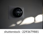 Thermostat in a house at sundown