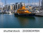 Small photo of Portishead Marina, Bristol, UK, 08-22-2021: The RNLB DORA FOSTER MCDOUGAL Rescue Vessel is Docked and Secured, Showing the Bow and Port Side of the Lifeboat Boat, Commissioned in 1997.