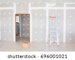 stair and gypsum board wall interior decoration of home at construction site with copy space add text