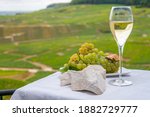 Small photo of White chalk stones from Cote des Blancs near Epernay, region Champagne, France, glass of blanc de blancs champagne from grand cru vineyards in Cramant and white chardonnay grapes close up