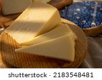 Small photo of Spanish hard manchego, cow, sheep and goat cheese served outdoor in morning sunlights close up