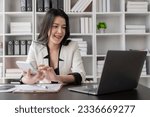 Small photo of Asian woman bookkeeper excited accounts payable, assets, book value, equity, inventory, cost of goods sold, depreciation, expenses, gross profit, diversification, liquidity Market Research Concepts