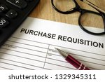 Small photo of Purchase requisition, pen, calculator and glasses on desk