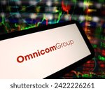 Small photo of Konskie, Poland - February 05, 2024: Omnicom Group company logo displayed on mobile phone