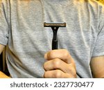 Machine for shaving. man shaving his beard with razor.man with beard and comb