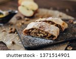 Strudel with apples and nuts. Composition  of delicious bakery products. Apple pie, cinnamon, honey, apples and walnuts.