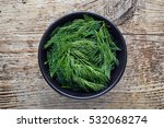 Bowl Of Fresh Dill On Wooden...