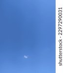 Small photo of only blue sky, daylight and small shapeless clouds