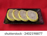 Small photo of Karashi lotus root is a local dish from Kumamoto Prefecture, made by stuffing the holes in a lotus root with mustard miso, coating it with yellow batt