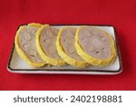Small photo of Karashi lotus root is a local dish from Kumamoto Prefecture, made by stuffing the holes in a lotus root with mustard miso, coating it with yellow batt