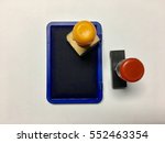 Small photo of Yellow and black rubber stamp with stamp pad. Isolated on white background. For business concept.
