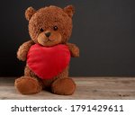 Woman Holding a Big Teddy Bear and Roses on Valentine's Day Free Stock  Photo