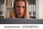 Small photo of Close up angry upset Caucasian woman user using laptop in home office frustrated mad confused shocked computer problem say what shock failure online stressed girl businesswoman mistake software error