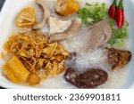 Small photo of Offal congee is a traditional Vietnamese dish made from rice cooked in a broth of pork offal, such as liver, heart, and tripe.