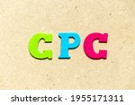 Color cloth alphabet letter in word CPC (Abbreviation of Cost per click) on wood background