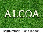 Small photo of Wood letter in word ALCOA (Abbreviation of Attributable, Legible, Contemporaneous, Original and Accurate) on green grass background