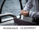 Small photo of A man in the sea holds a piece of uneaten bread.