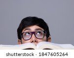 Small photo of Education today make guy student read Textbook like Mad. Office business man with glasses express feeling stress and work overload on big report. White background isolated copy space